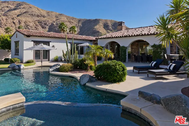 a view of a swimming pool with a patio