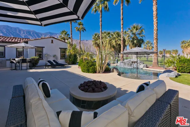 an aerial view of multiple houses with yard