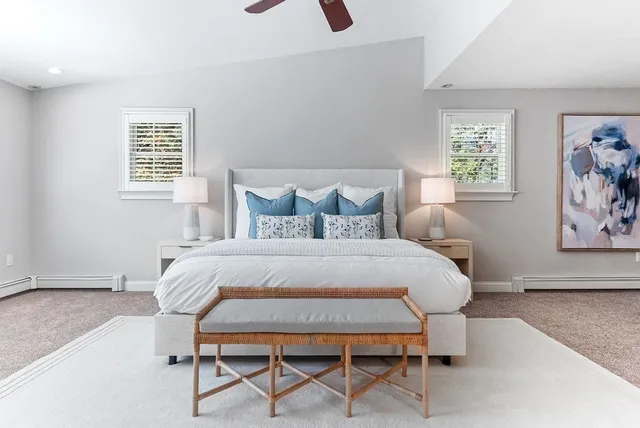 a bedroom with a bed a table and chair