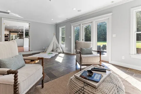 a living room with furniture and a window