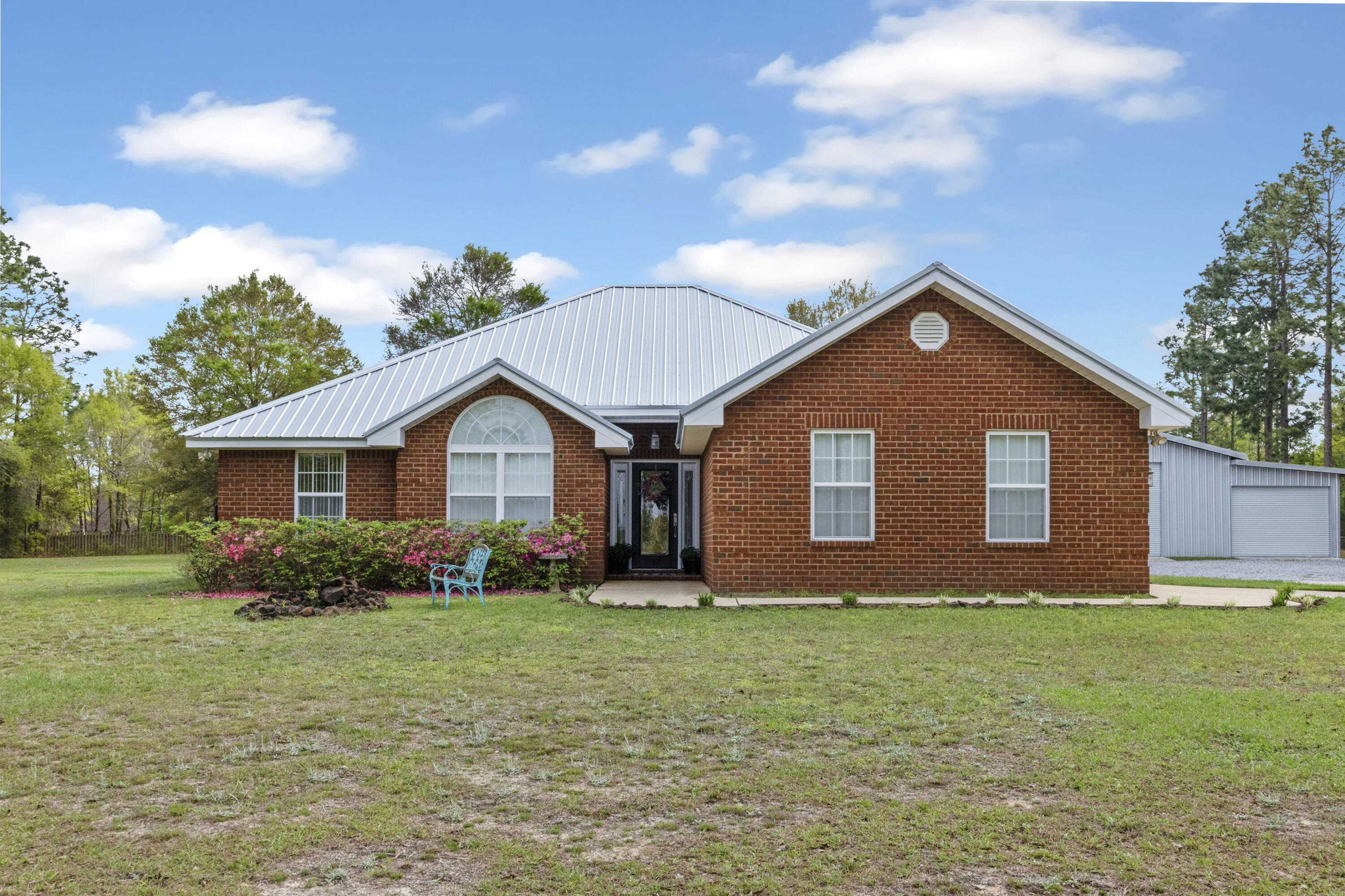 1582 Greenwood Road Baker, FL 32531 - Photo 1 of 52 a front view of house with yard and trees