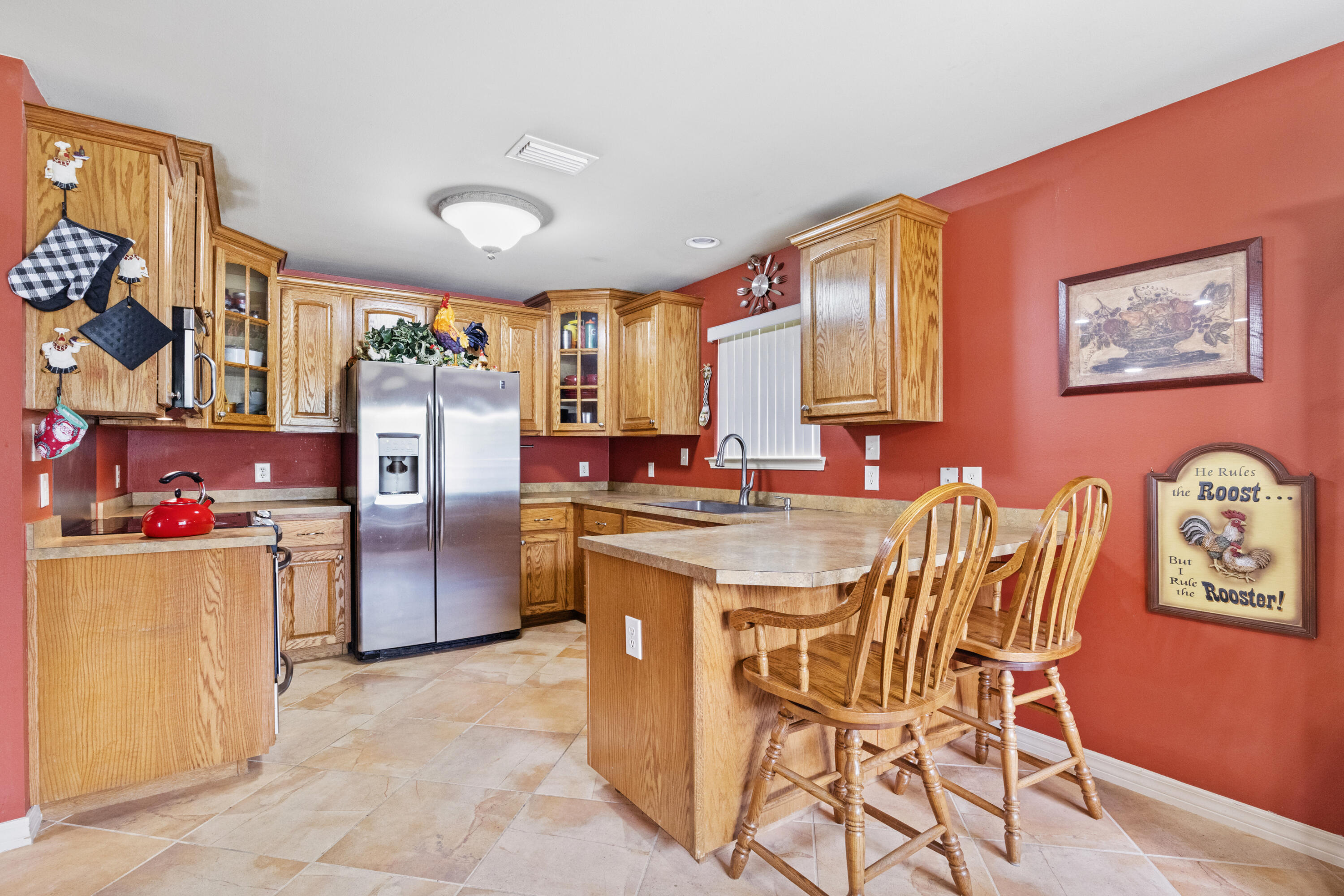 1582 Greenwood Road Baker, FL 32531 - Photo 11 of 52 a dining hall with a dining table and chairs