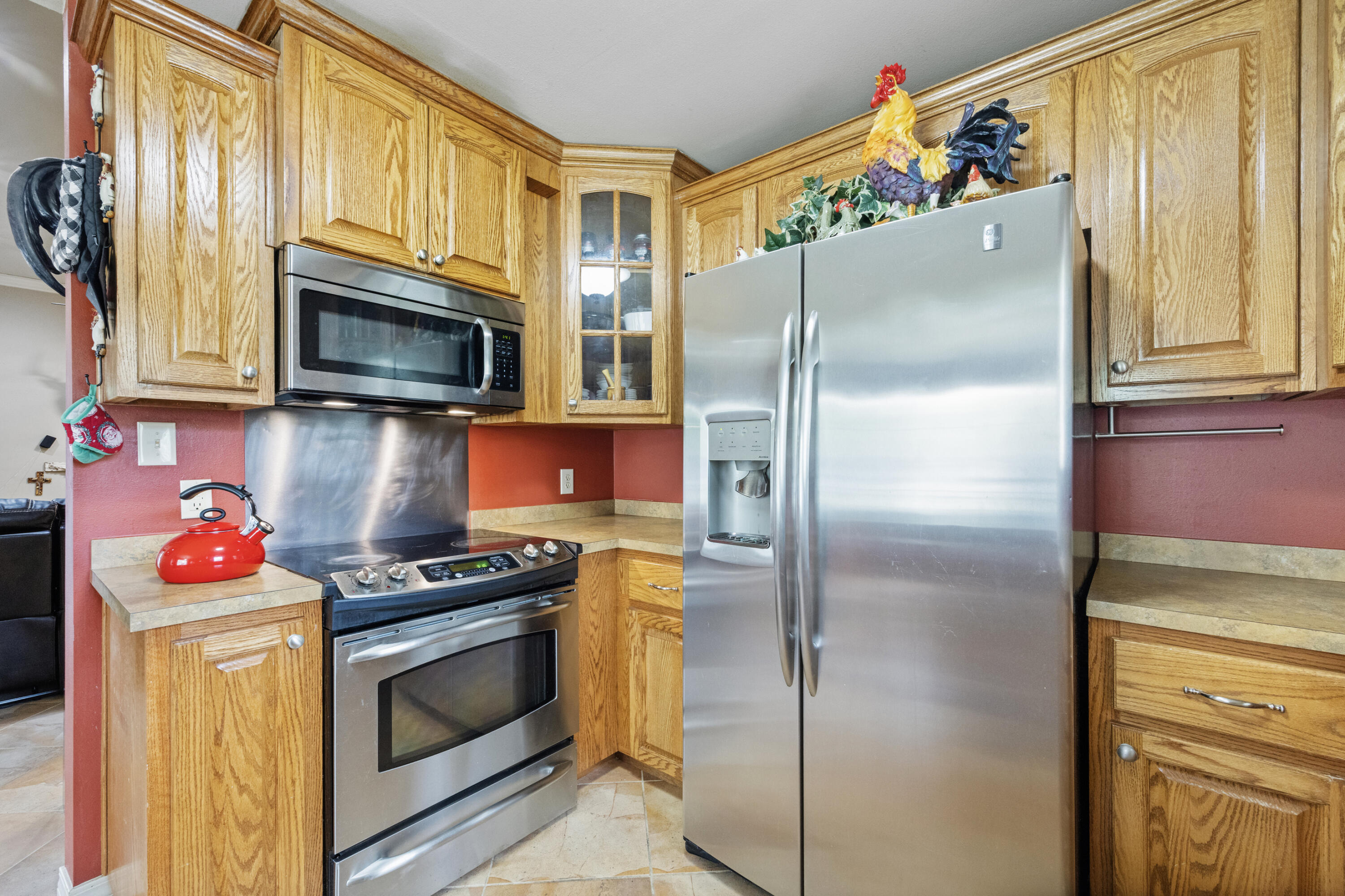 1582 Greenwood Road Baker, FL 32531 - Photo 15 of 52 a kitchen with stainless steel appliances granite countertop a refrigerator stove and microwave