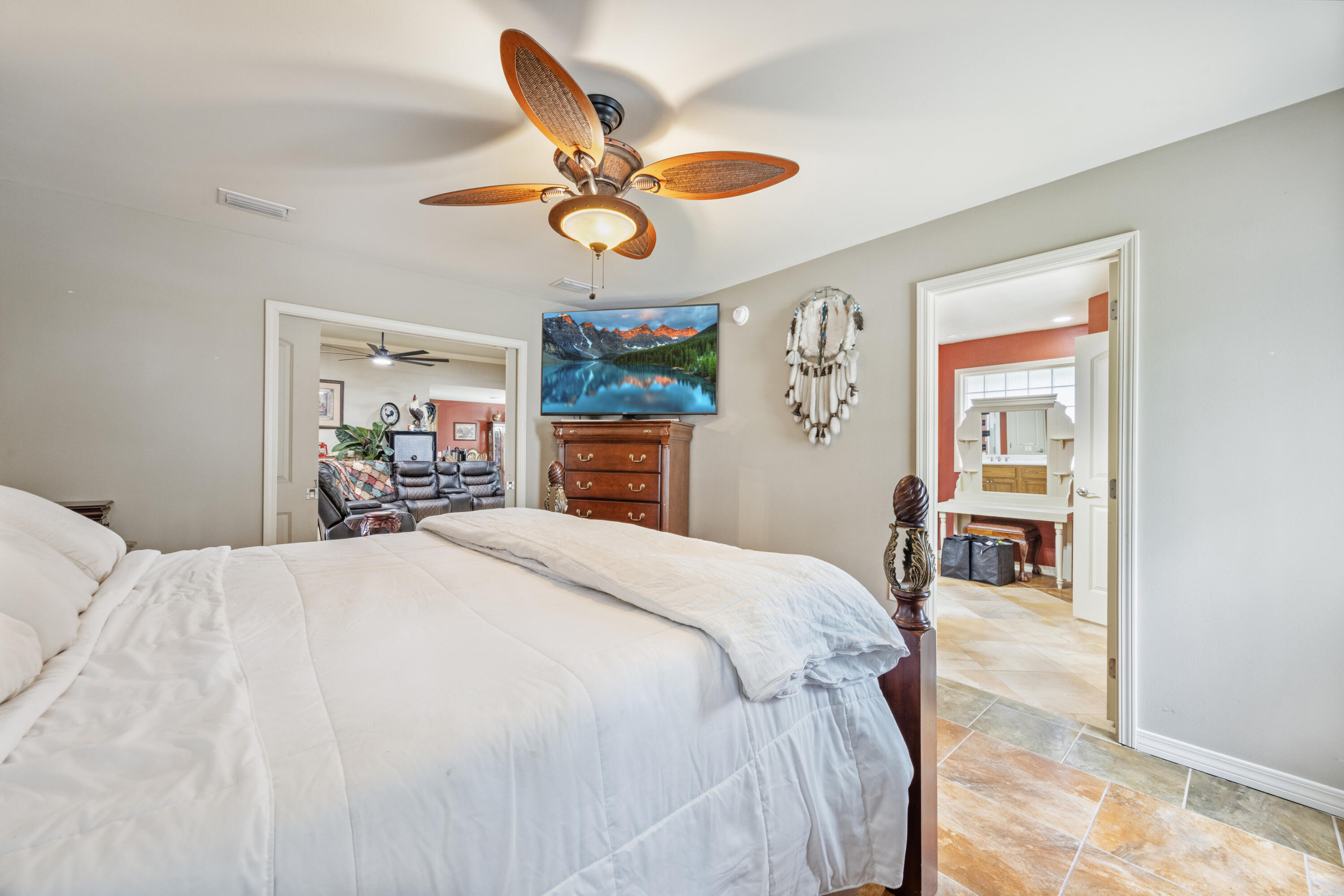 1582 Greenwood Road Baker, FL 32531 - Photo 18 of 52 a bed room with a bed and a chandelier