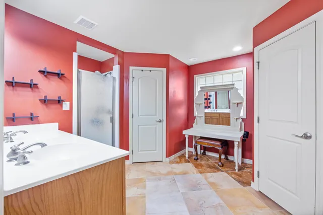 a bathroom with a double vanity sink mirror and double