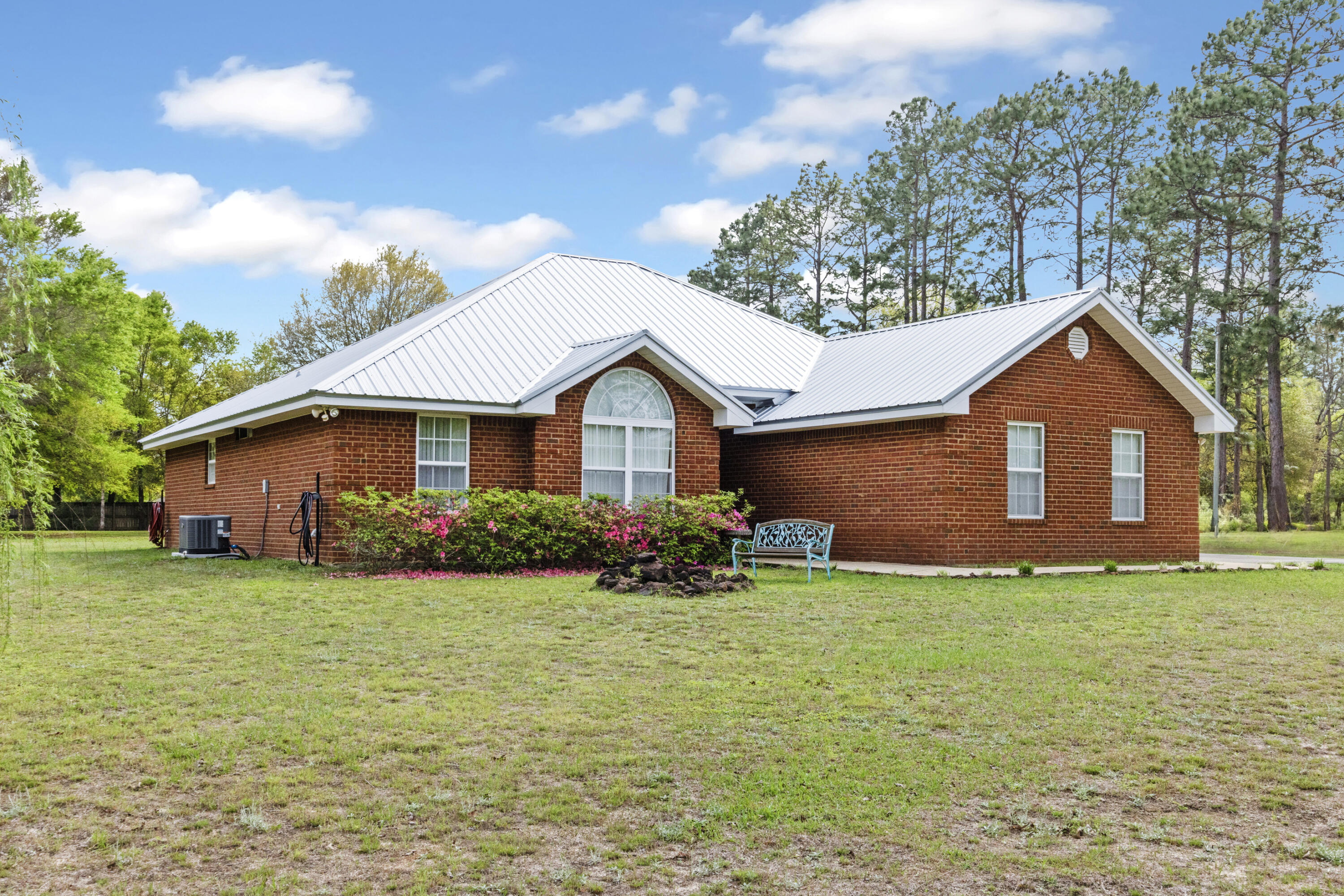 1582 Greenwood Road Baker, FL 32531 - Photo 2 of 52 a front view of a house with yard