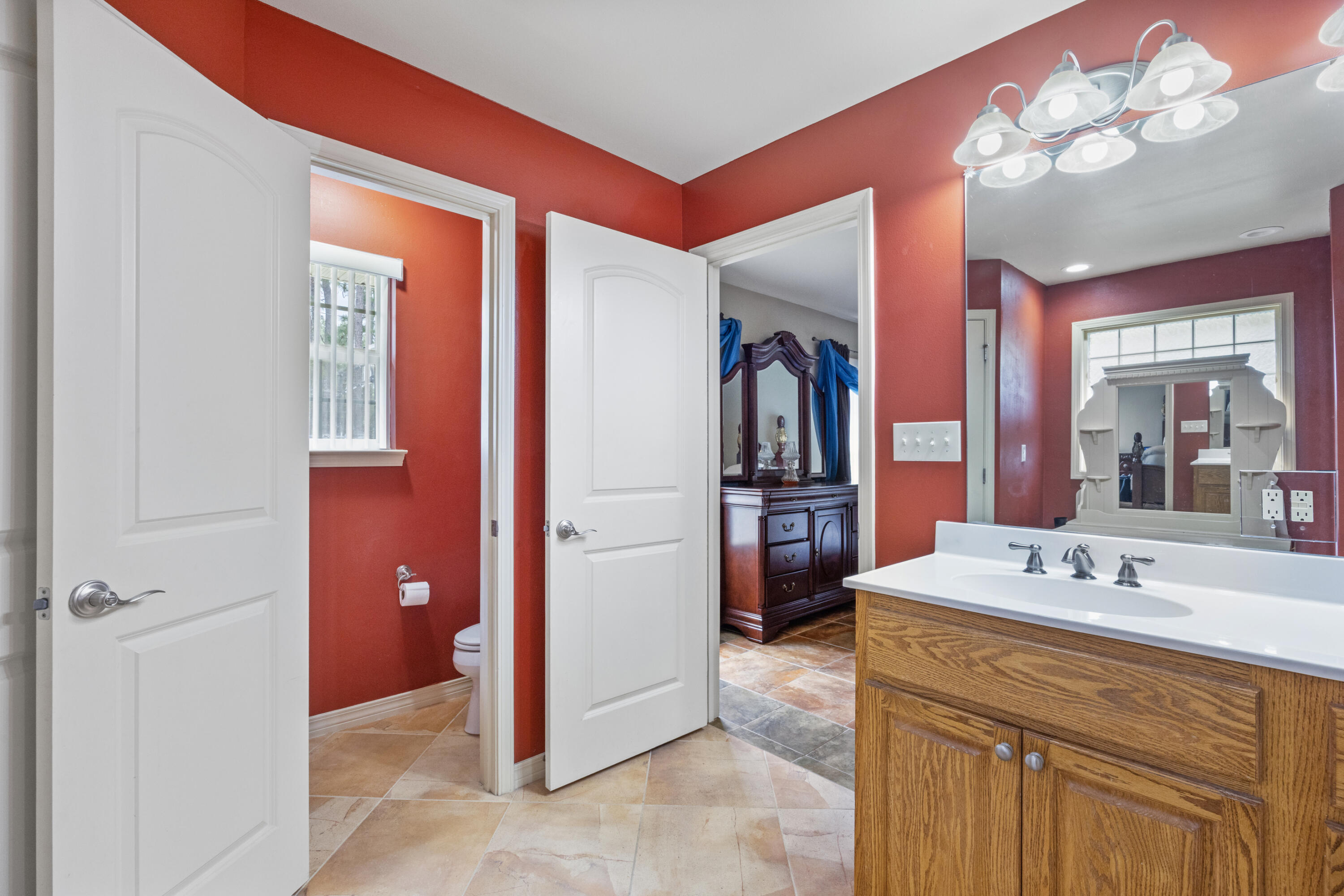 1582 Greenwood Road Baker, FL 32531 - Photo 21 of 52 a bathroom with a sink a vanity and a mirror