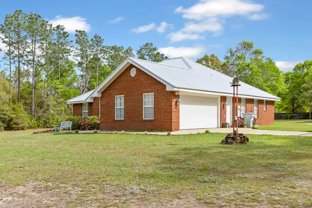 a house with garden in front of it