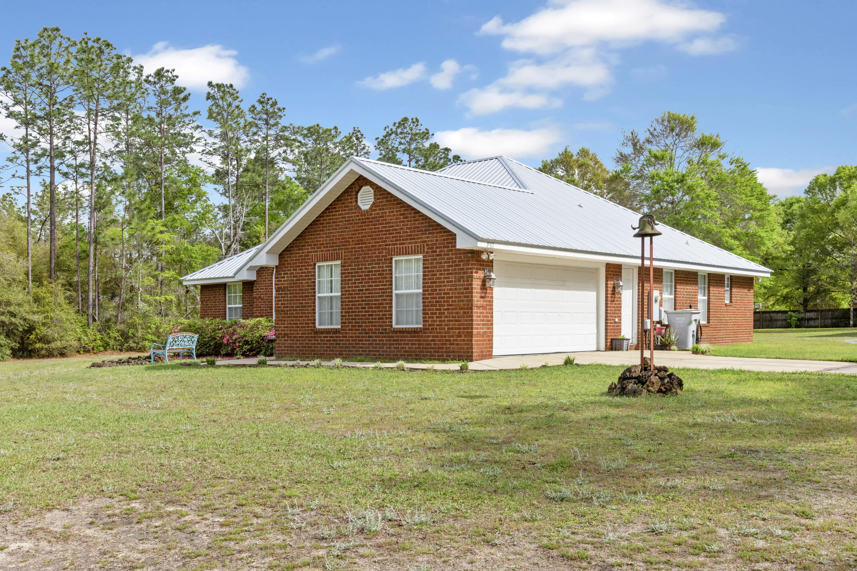 1582 Greenwood Road Baker, FL 32531 - Photo 3 of 52 a house with garden in front of it