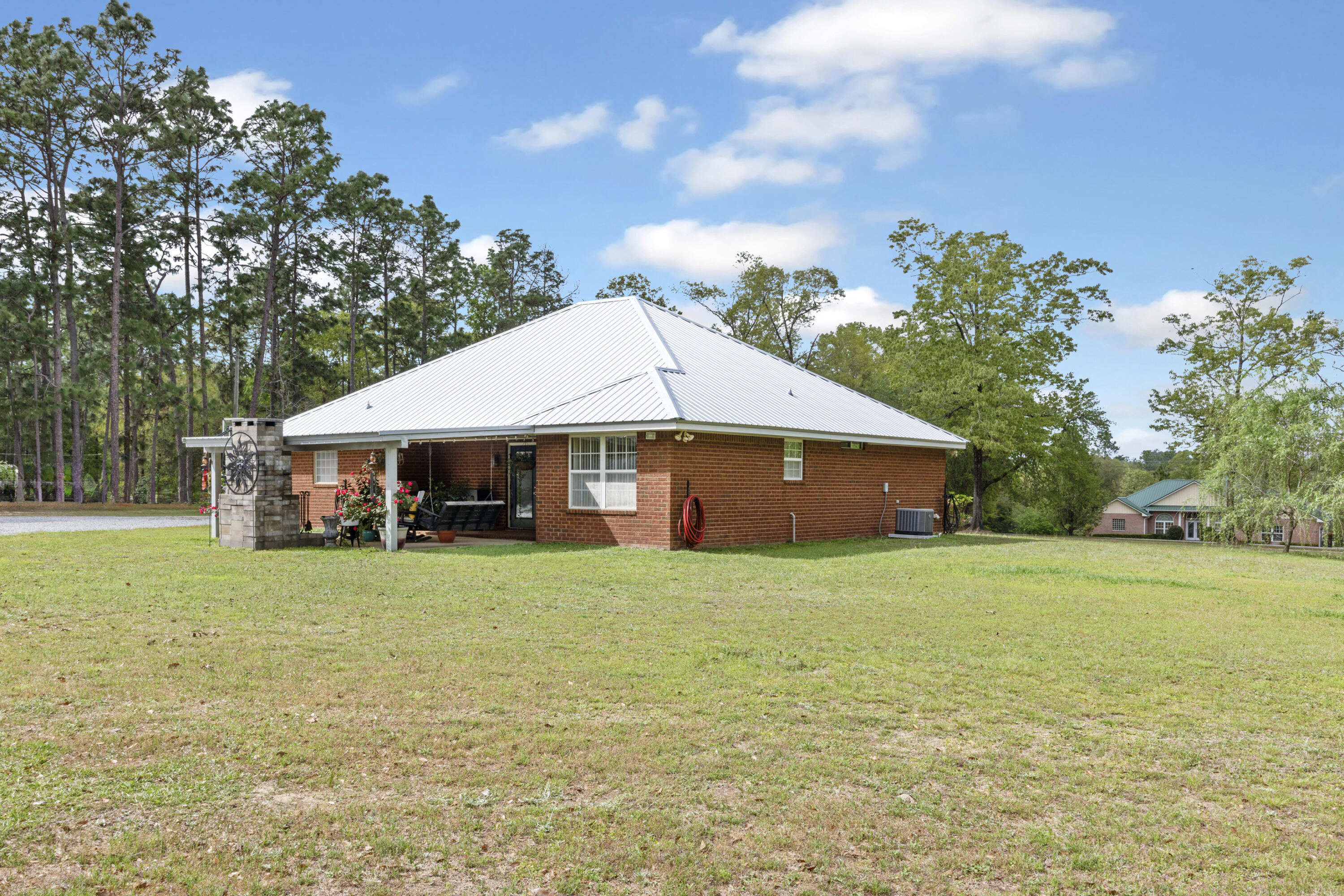 1582 Greenwood Road Baker, FL 32531 - Photo 31 of 52 a house with trees in the background