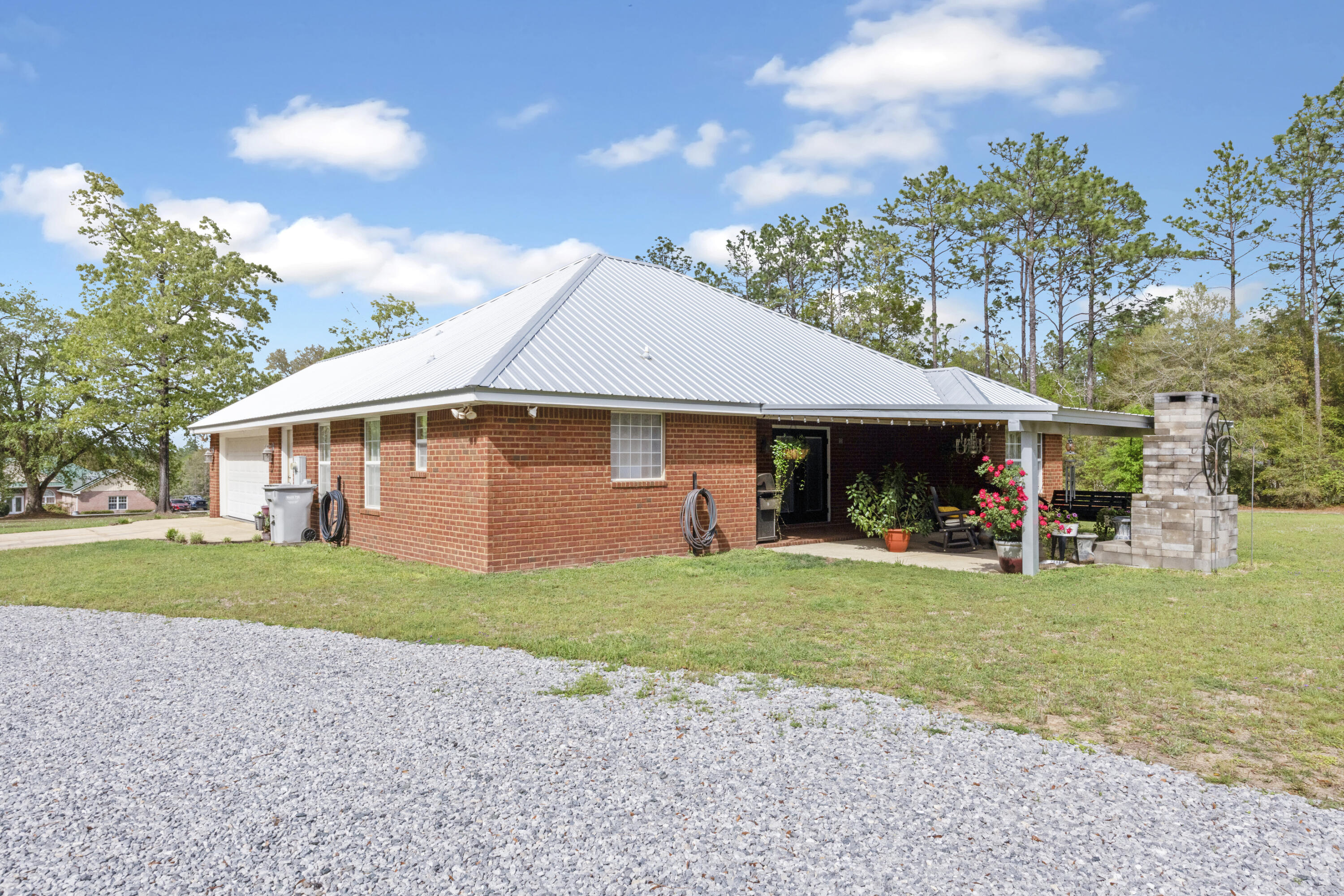 1582 Greenwood Road Baker, FL 32531 - Photo 32 of 52 a front view of a house with garden