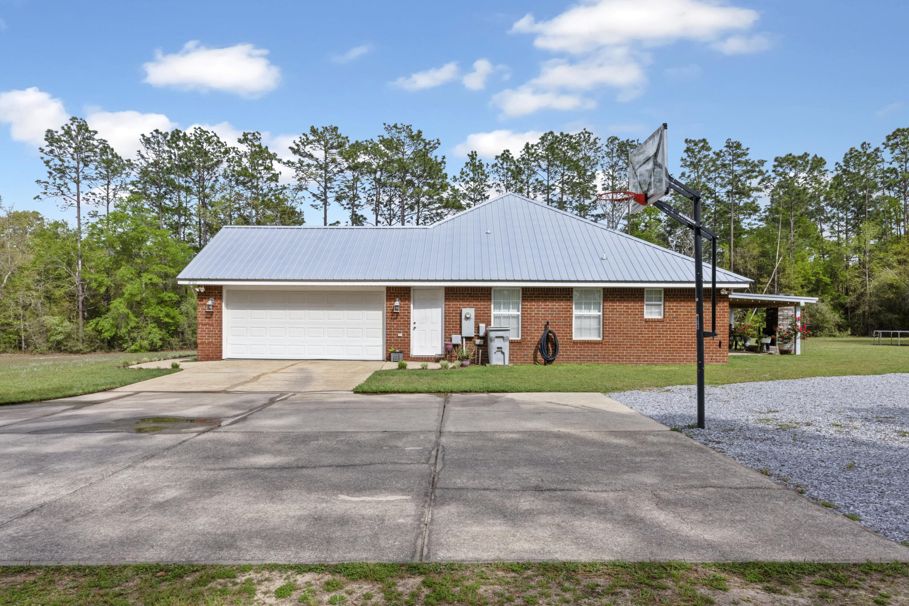 1582 Greenwood Road Baker, FL 32531 - Photo 33 of 52 a view of a house with a yard and large tree