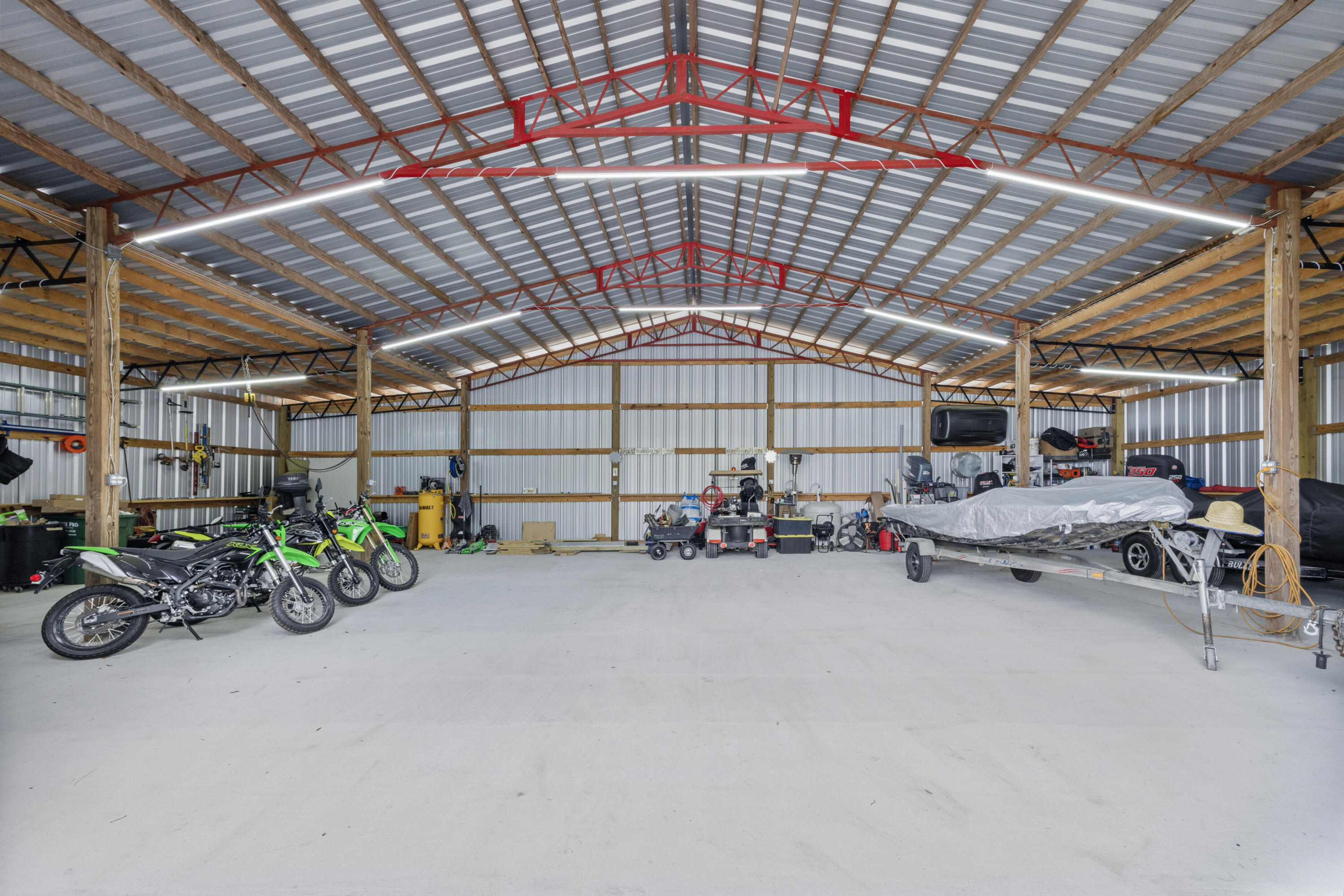 1582 Greenwood Road Baker, FL 32531 - Photo 36 of 52 a view of a garage with a table and chairs