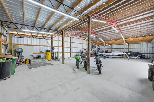 a view of a garage with a table and a chairs