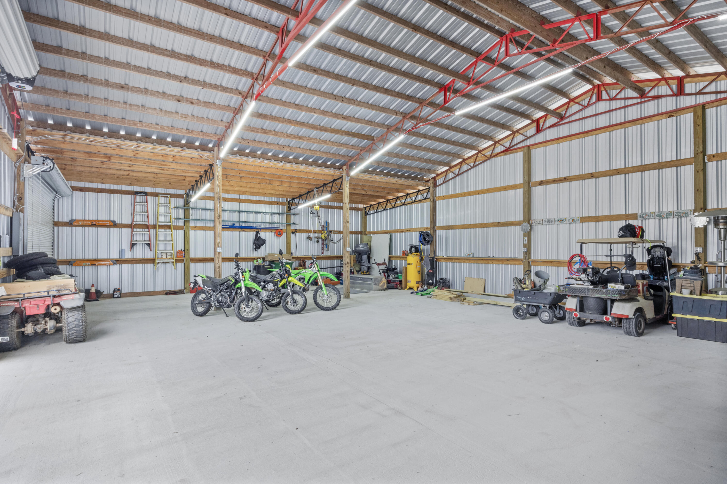 1582 Greenwood Road Baker, FL 32531 - Photo 39 of 52 a view of a garage with a table and a chairs
