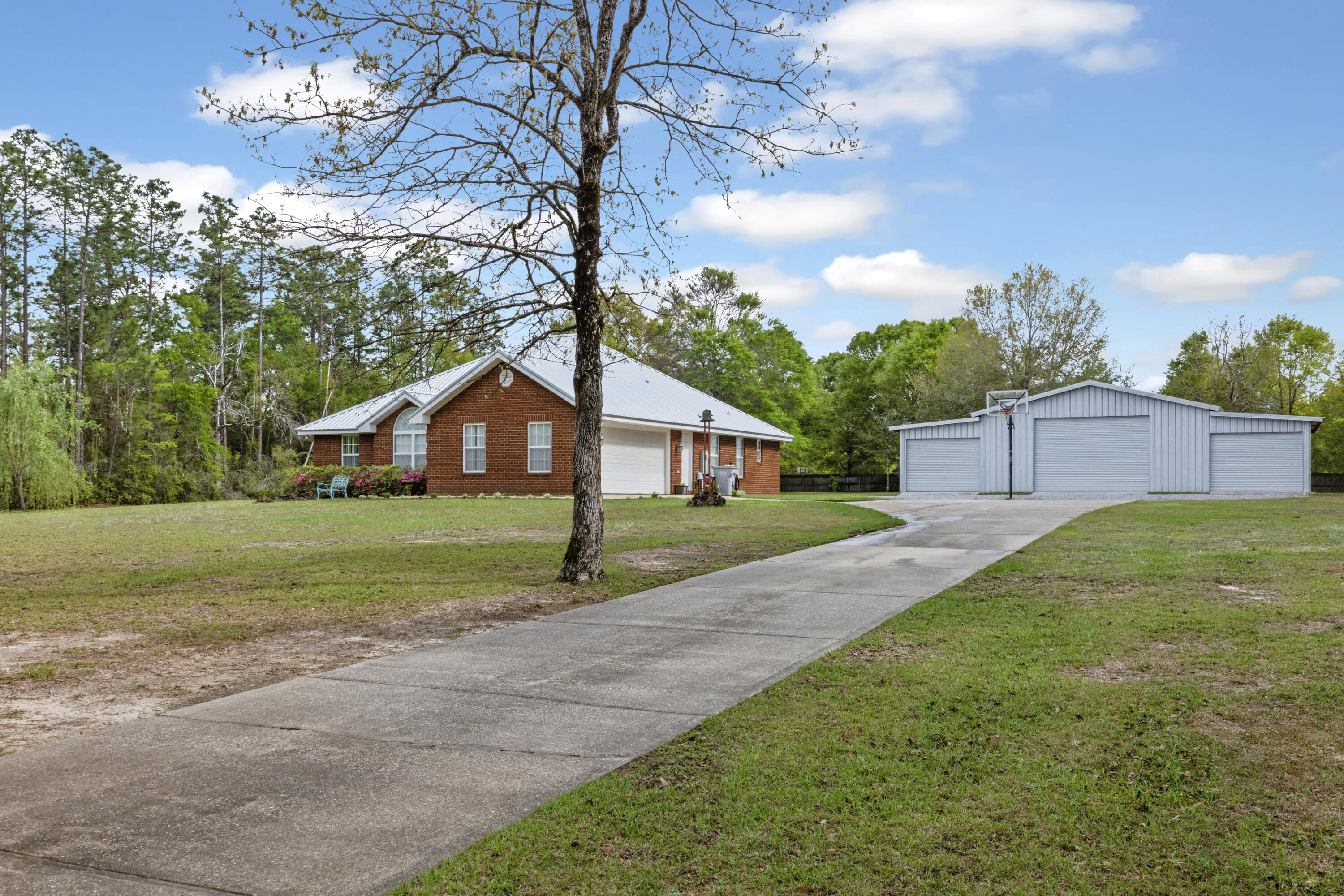 1582 Greenwood Road Baker, FL 32531 - Photo 4 of 52 a front view of house with yard and green space