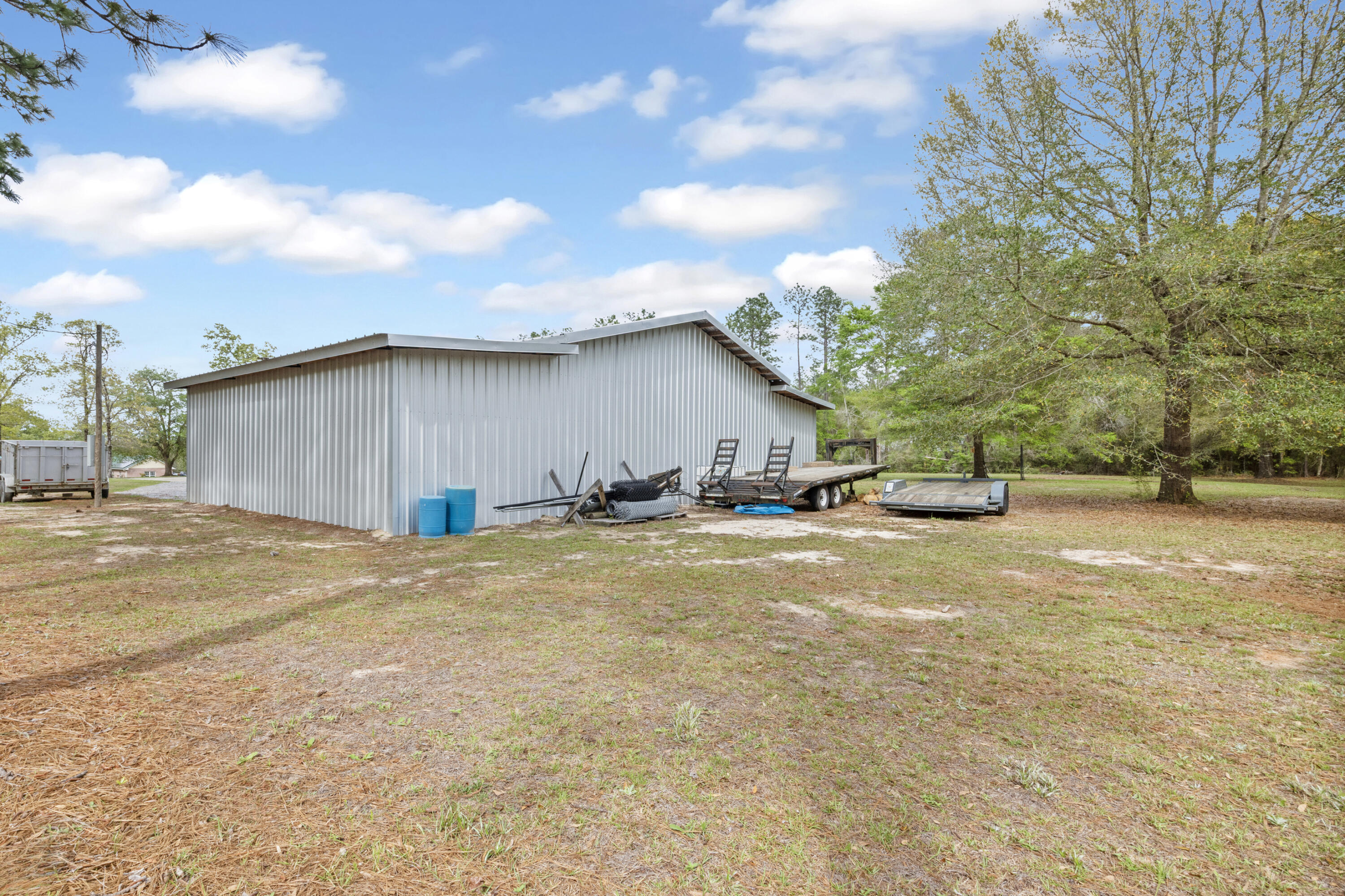 1582 Greenwood Road Baker, FL 32531 - Photo 41 of 52 a view of a house with a yard and garage
