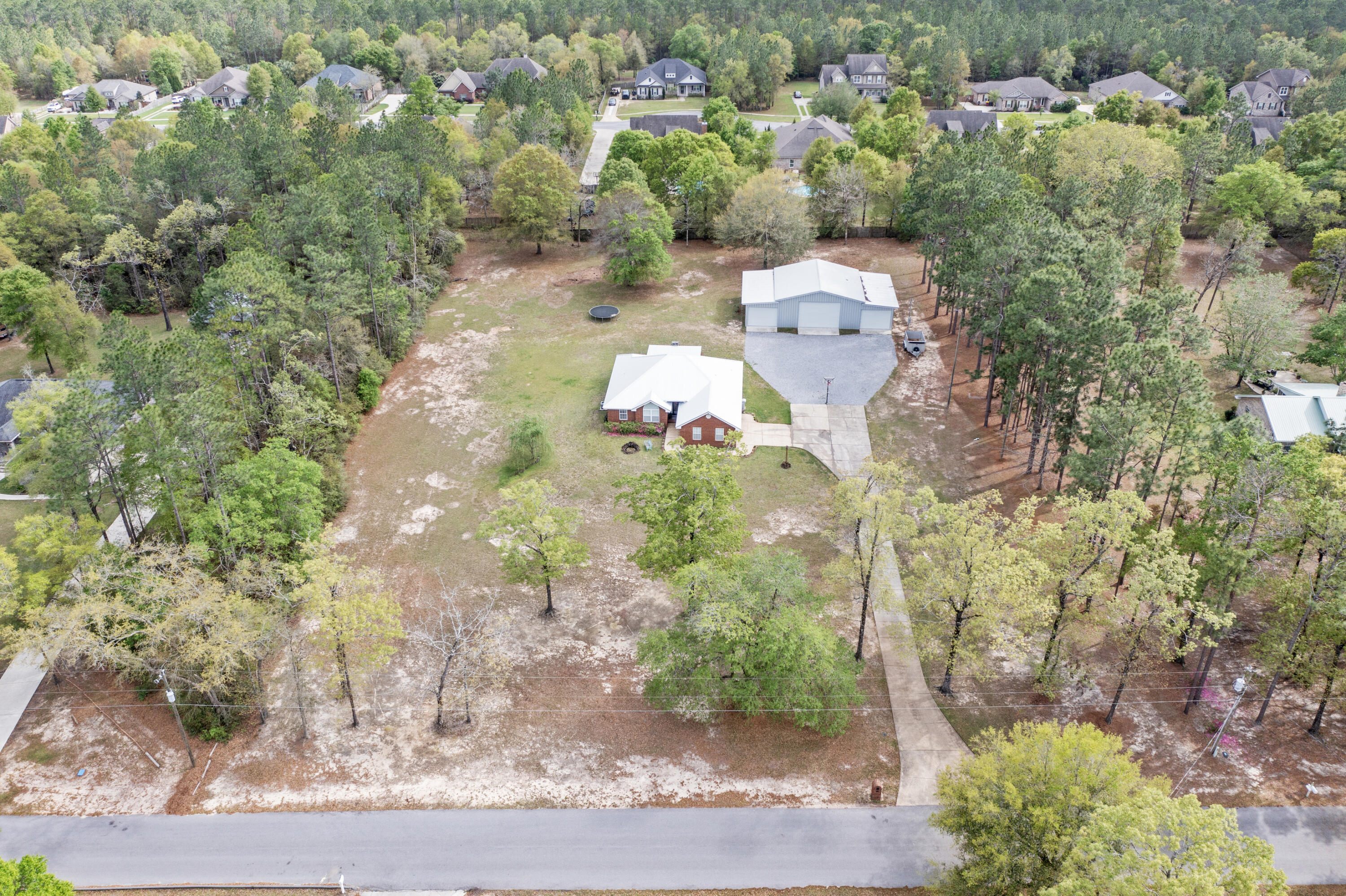 1582 Greenwood Road Baker, FL 32531 - Photo 44 of 52 a view of a lot of trees and houses