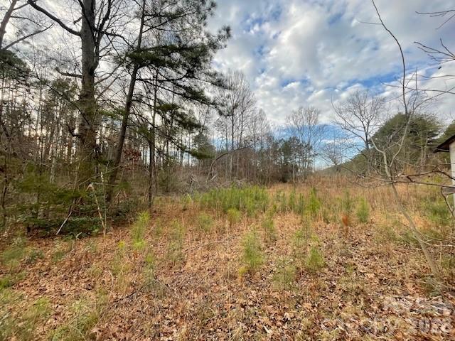 a view of lake with a yard