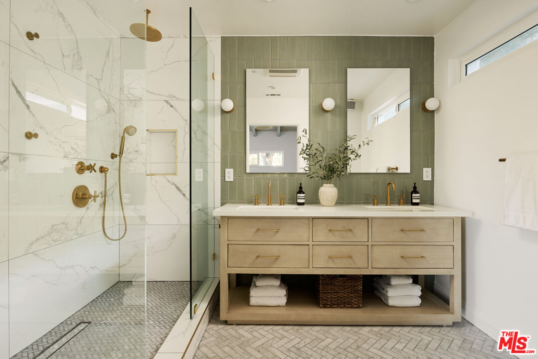 14833 Valley Vista Boulevard Sherman Oaks, CA 91403 - Photo 14 of 39 a bathroom with a double vanity sink mirror and shower