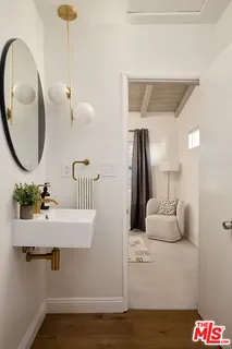 a bathroom with a sink and mirror