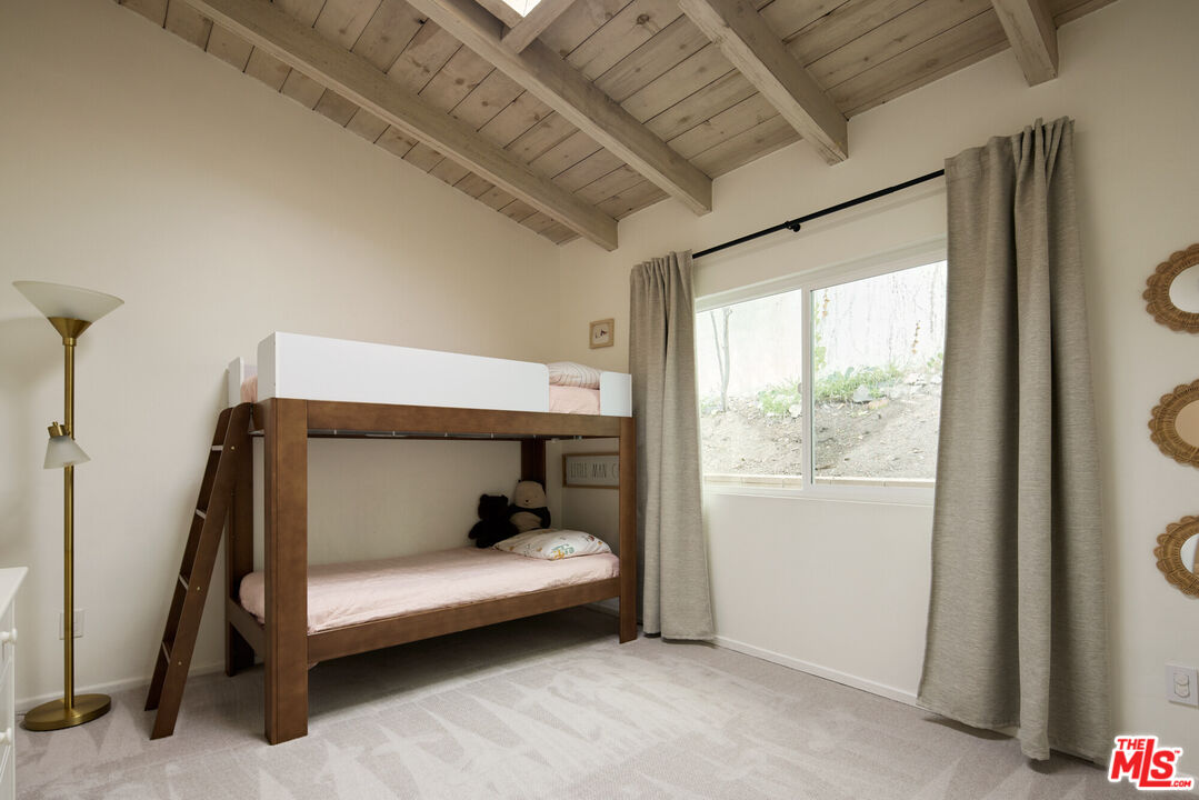 14833 Valley Vista Boulevard Sherman Oaks, CA 91403 - Photo 19 of 39 a room with a bed and a window