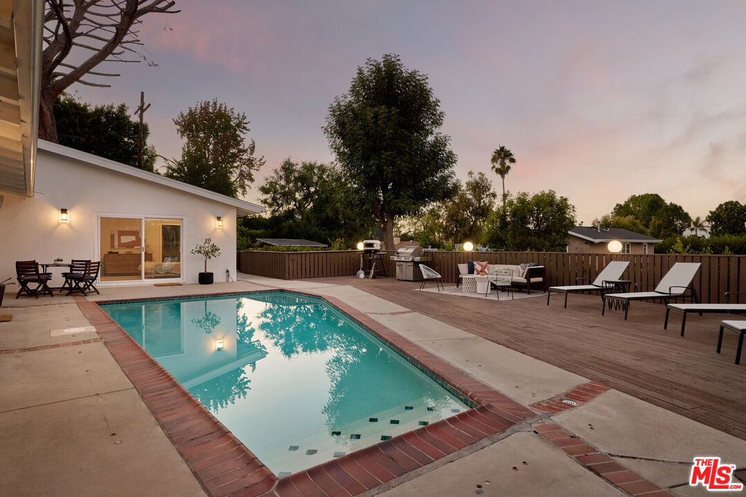 14833 Valley Vista Boulevard Sherman Oaks, CA 91403 - Photo 23 of 39 a view of a swimming pool with chairs
