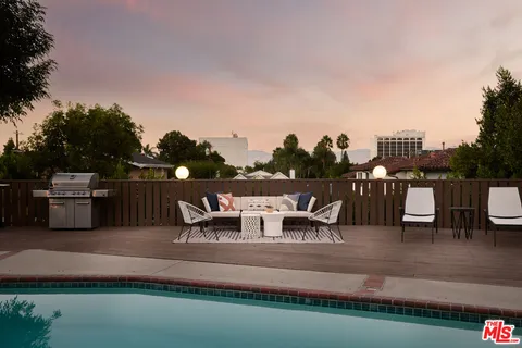 a view of a lake with outdoor seating