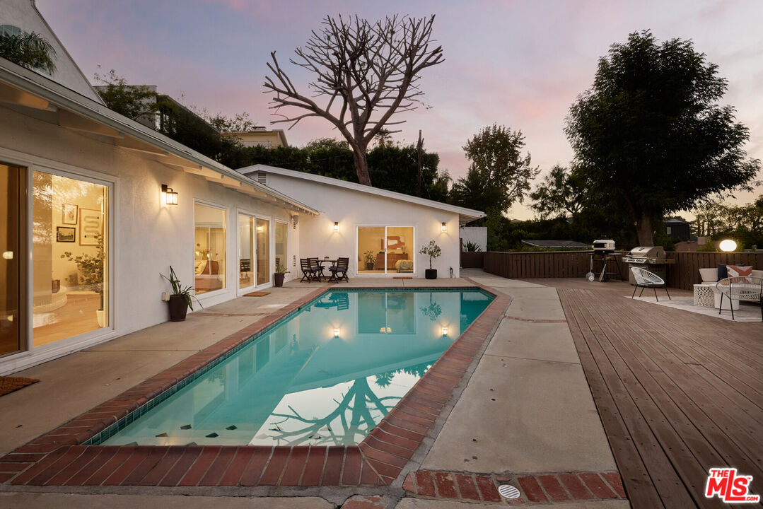 14833 Valley Vista Boulevard Sherman Oaks, CA 91403 - Photo 26 of 39 a view of a house with backyard swimming pool and sitting area
