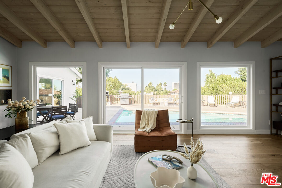 14833 Valley Vista Boulevard Sherman Oaks, CA 91403 - Photo 6 of 39 a living room with furniture and a large window
