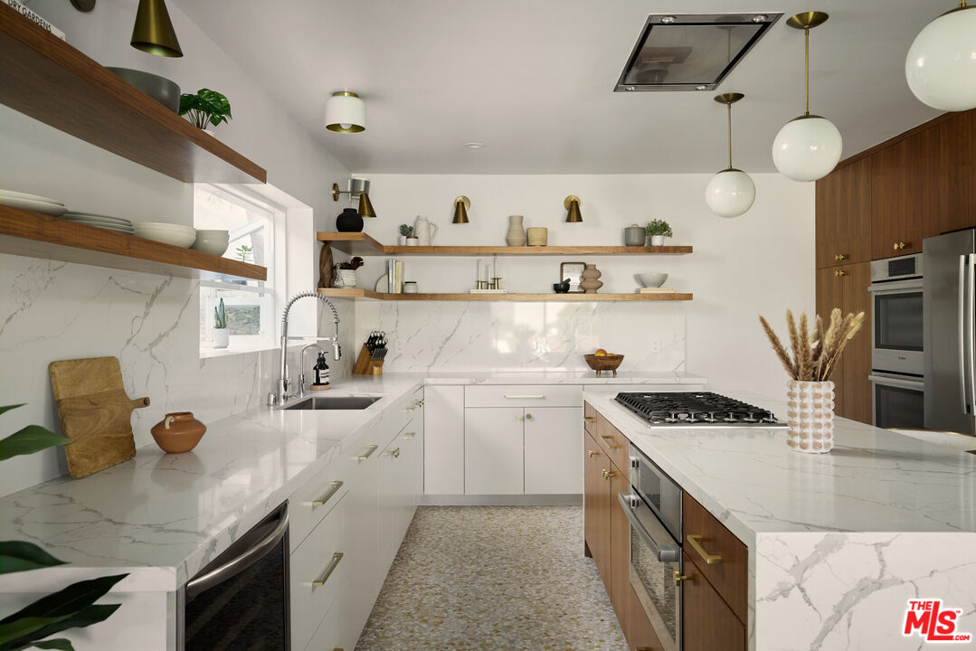 14833 Valley Vista Boulevard Sherman Oaks, CA 91403 - Photo 10 of 39 a kitchen with a sink a stove and cabinets