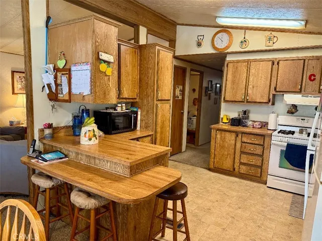 a kitchen with a table chairs and a stove