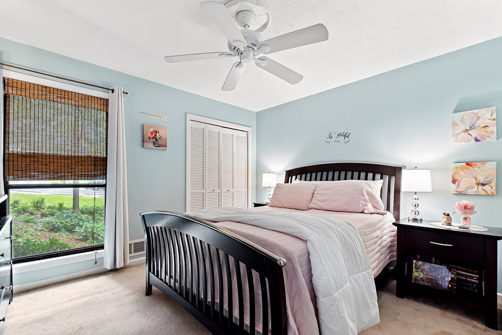 706 Magnolia Way Woodstock, GA 30188 - Photo 16 of 24 a bedroom with a bed and a window