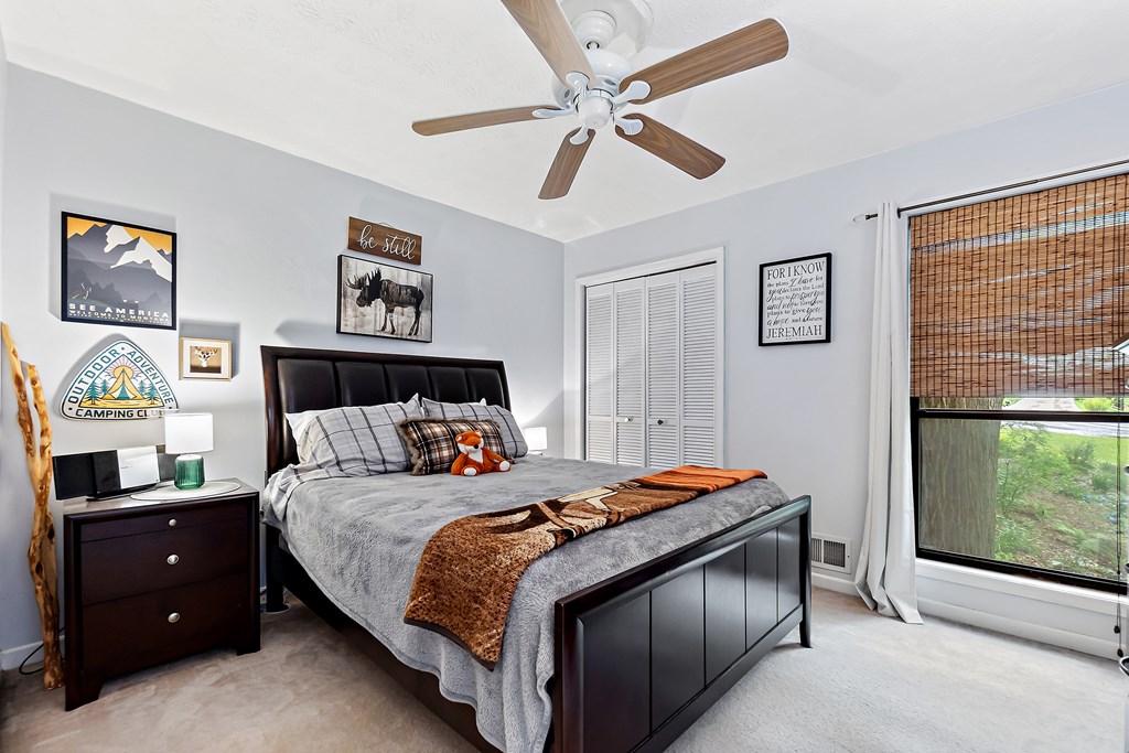 706 Magnolia Way Woodstock, GA 30188 - Photo 17 of 24 a bedroom with a bed and a window