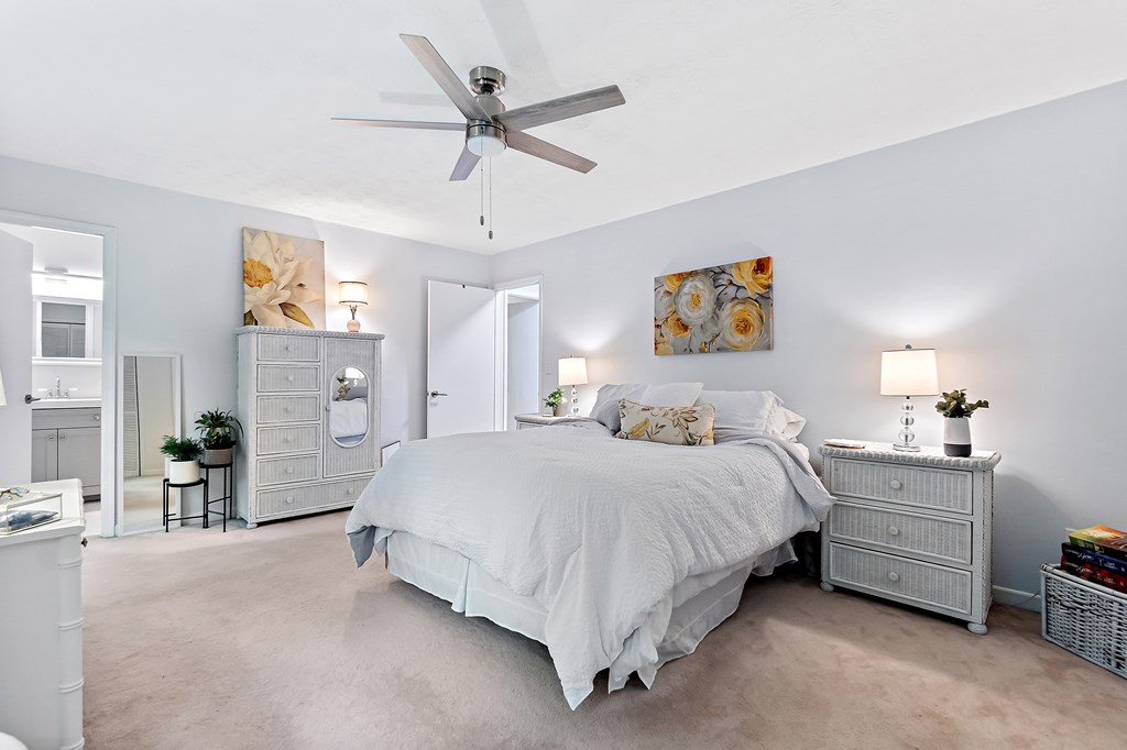 706 Magnolia Way Woodstock, GA 30188 - Photo 21 of 24 a bed room with a bed and a chandelier