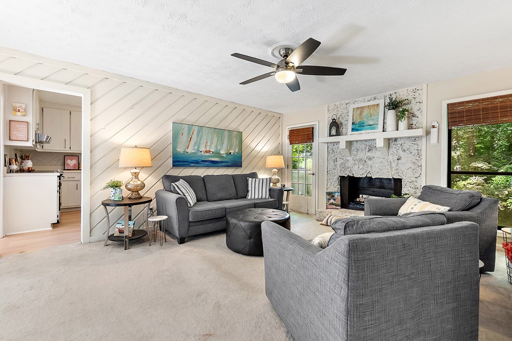 706 Magnolia Way Woodstock, GA 30188 - Photo 4 of 24 a living room with furniture and a fireplace