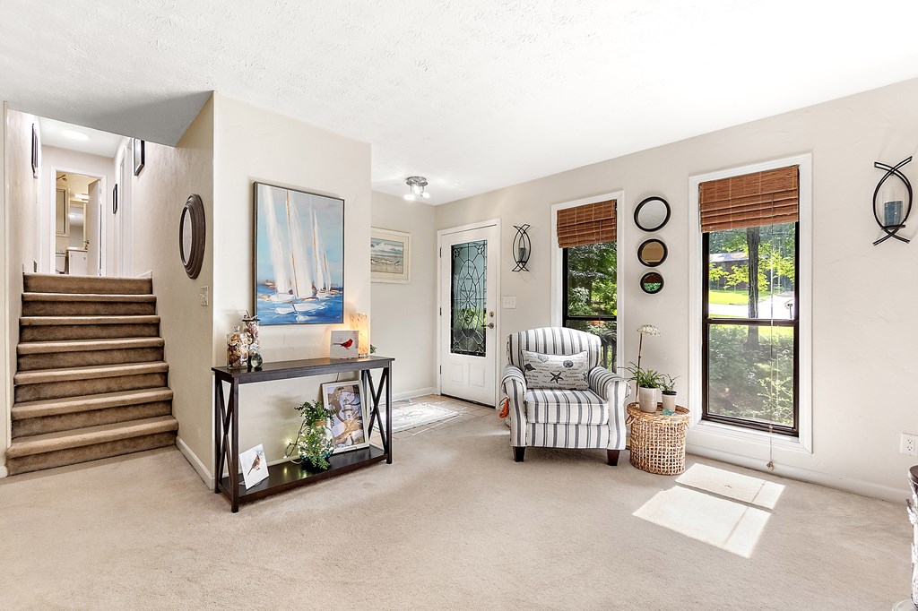 706 Magnolia Way Woodstock, GA 30188 - Photo 5 of 24 a living room with furniture and a large window