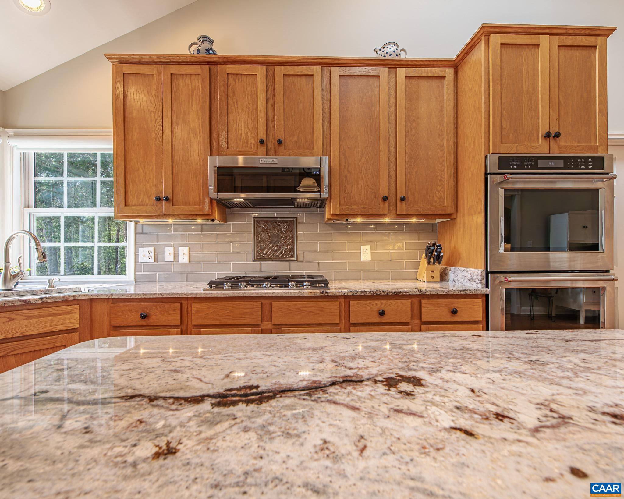 1089 Broken Island Road Palmyra, VA 22963 - Photo 28 of 74 a kitchen with stainless steel appliances granite countertop a stove a sink and a microwave