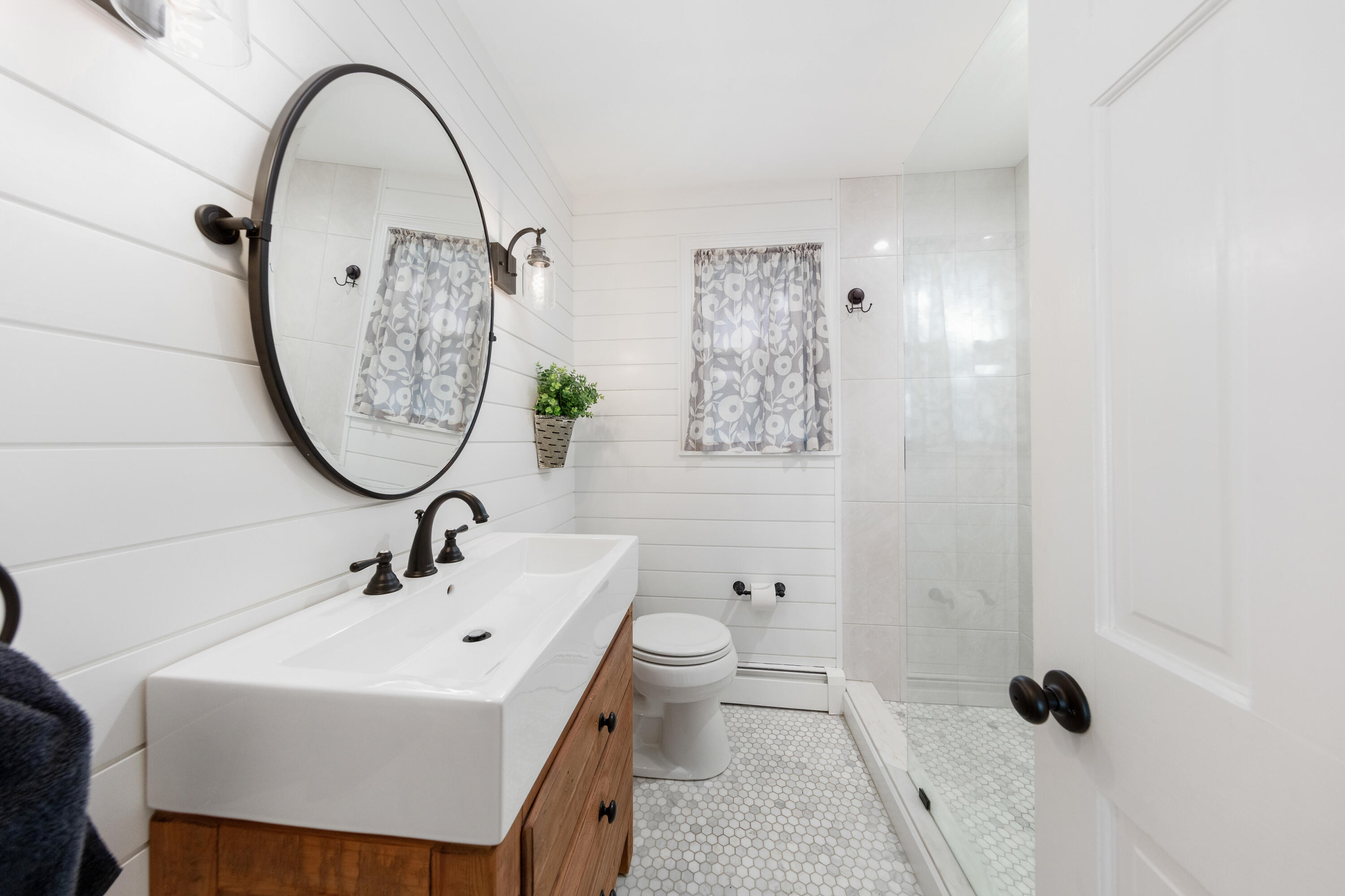 12 Miles Road Darien, CT 06820 - Photo 15 of 31 a bathroom with a sink toilet and a mirror
