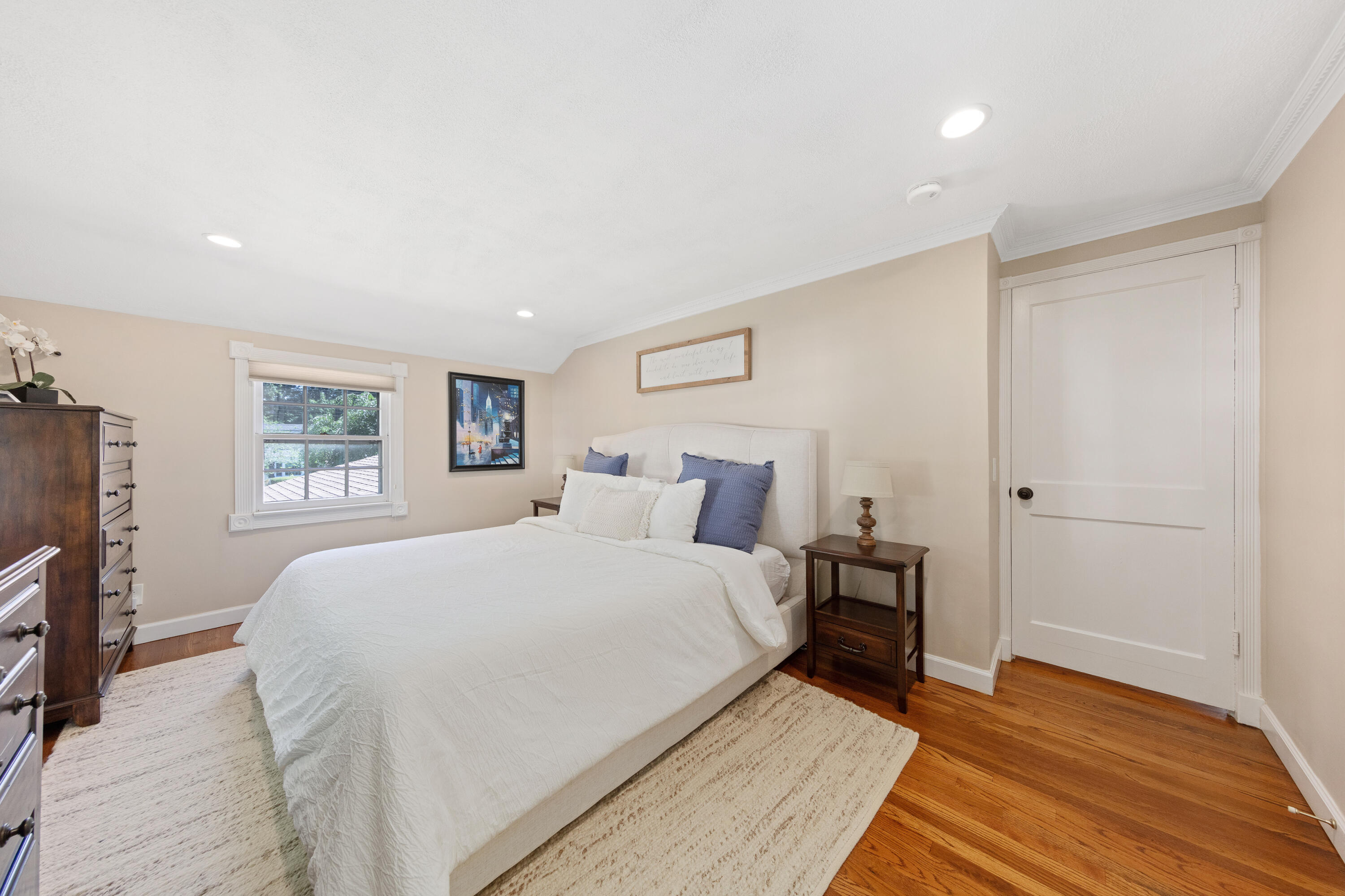 12 Miles Road Darien, CT 06820 - Photo 18 of 31 a large bedroom with a bed and wooden floor