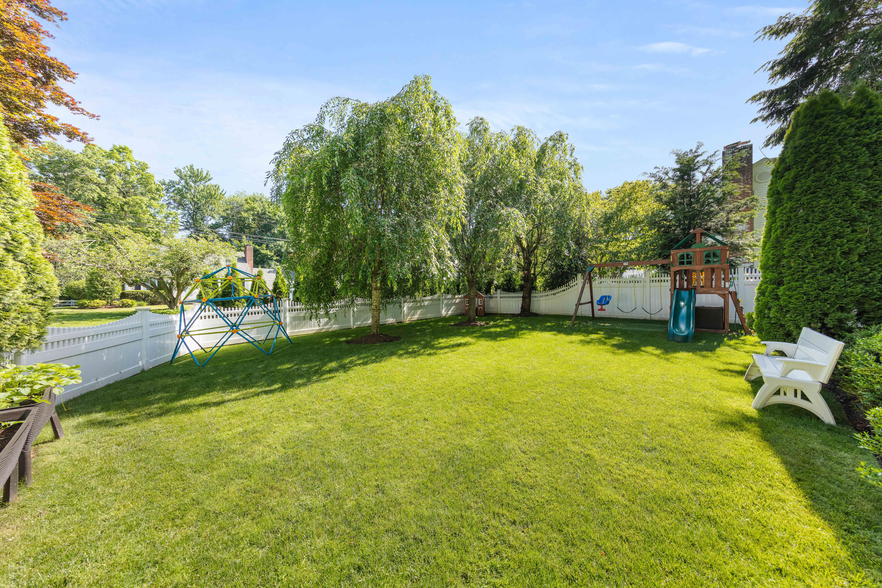 12 Miles Road Darien, CT 06820 - Photo 27 of 31 a view of a swimming pool with an outdoor seating and a yard