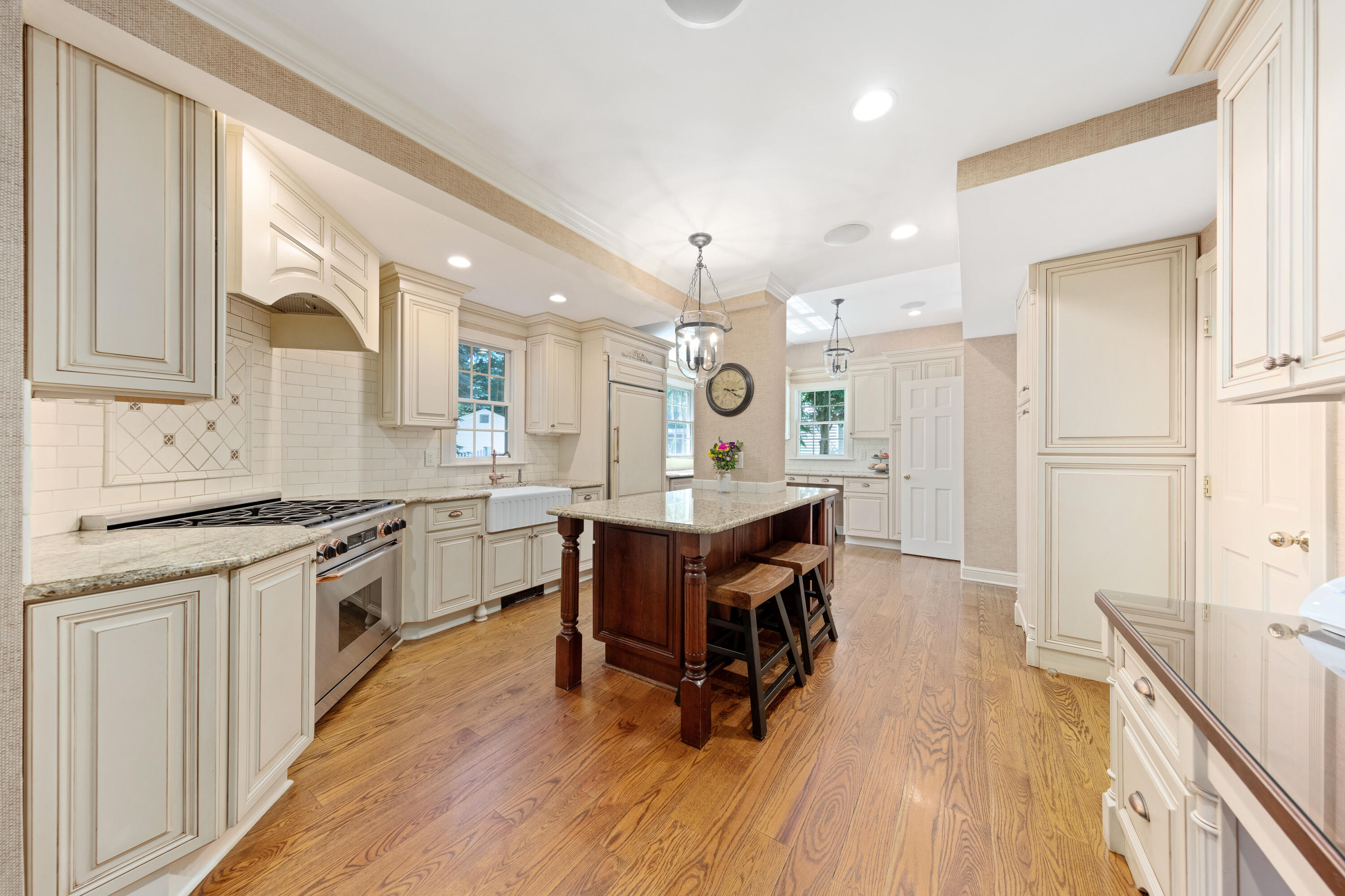 12 Miles Road Darien, CT 06820 - Photo 6 of 31 a large kitchen with cabinets wooden floor and stainless steel appliances
