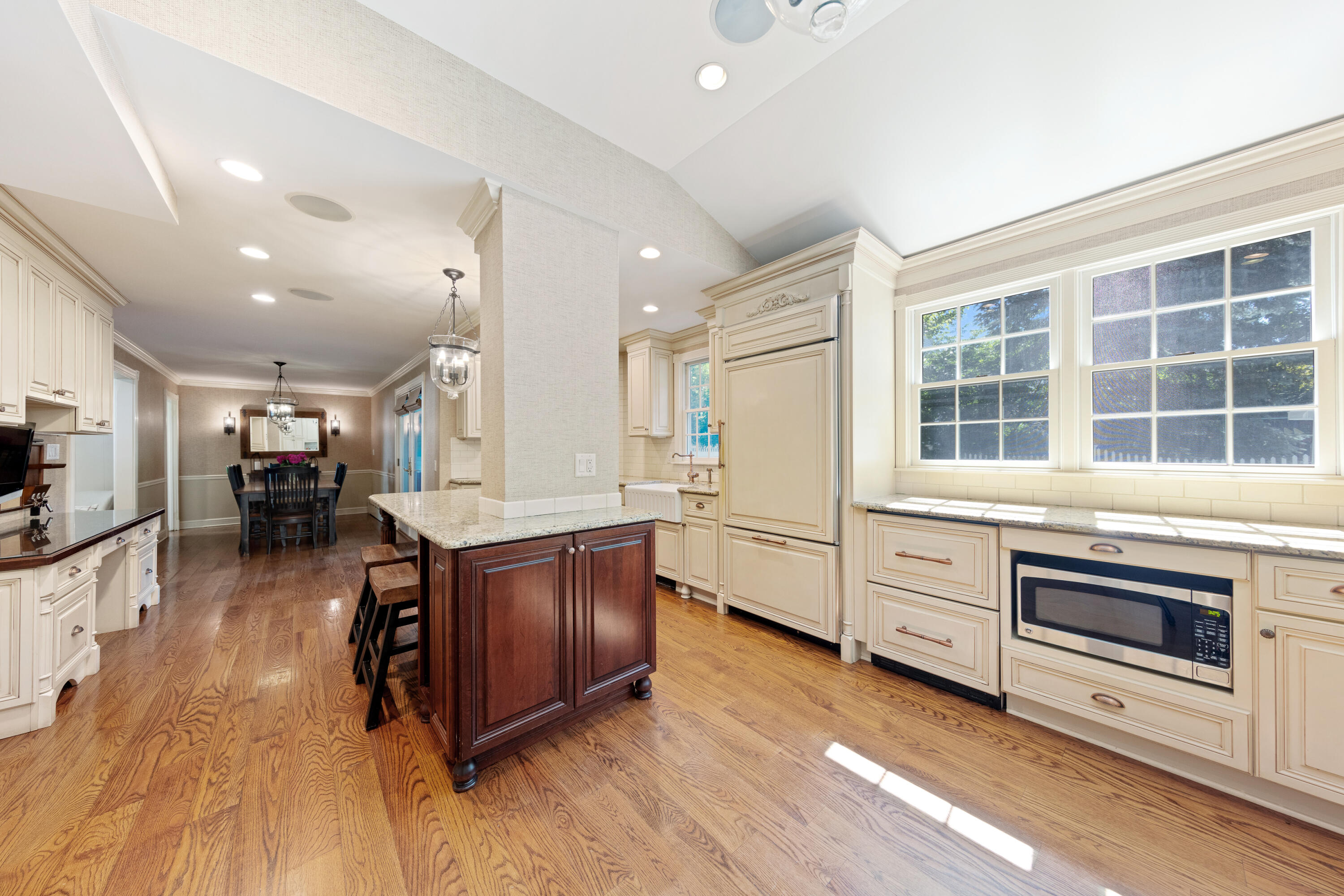12 Miles Road Darien, CT 06820 - Photo 8 of 31 a kitchen with stainless steel appliances kitchen island granite countertop a stove and a wooden floors