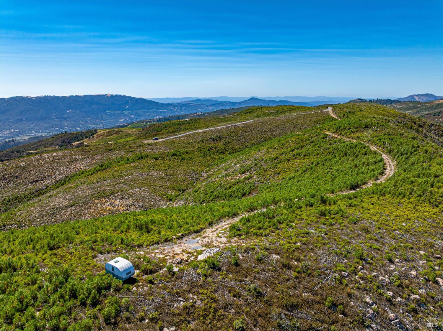 4420 Cavedale Road Sonoma, CA 95476 - Photo 12 of 25 Northerly view from Napa property border with building pad and driveway shown in the distance.