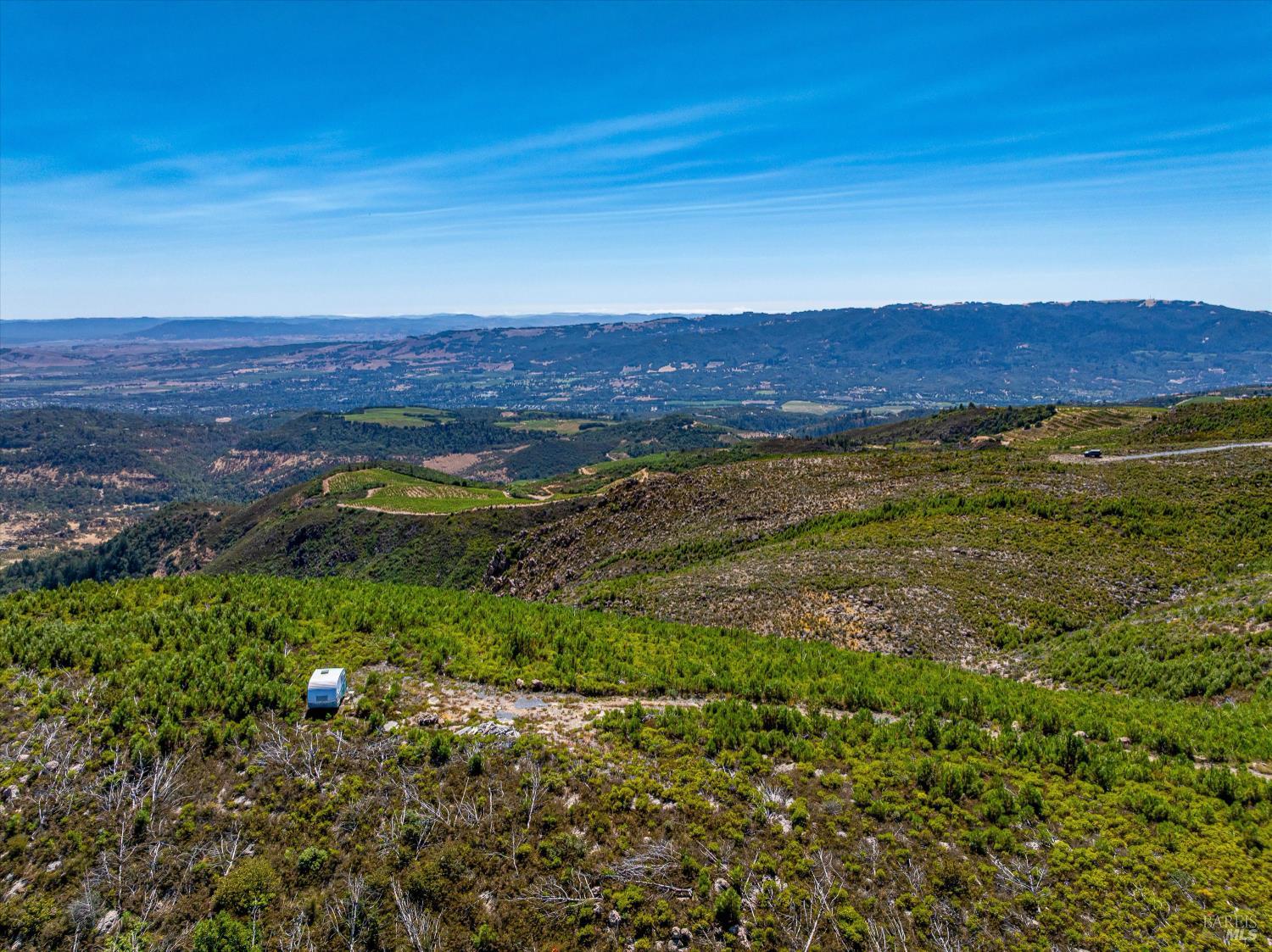 4420 Cavedale Road Sonoma, CA 95476 - Photo 14 of 25 Southerly view from flat view spot. Building area and driveway to the right on the distance.