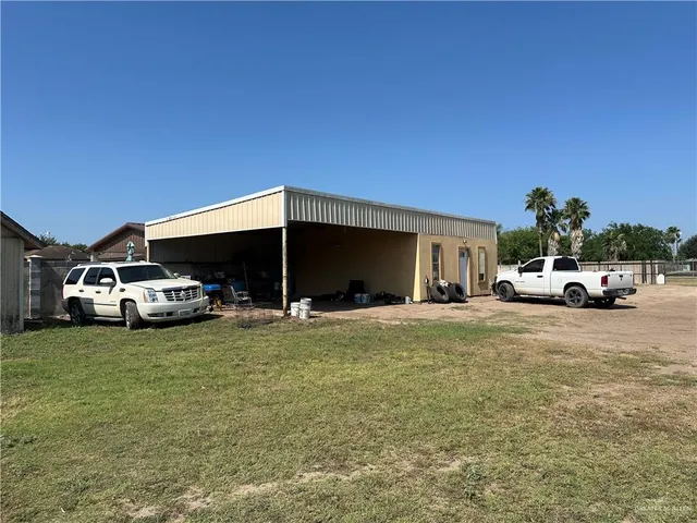a view of a car park in front of house