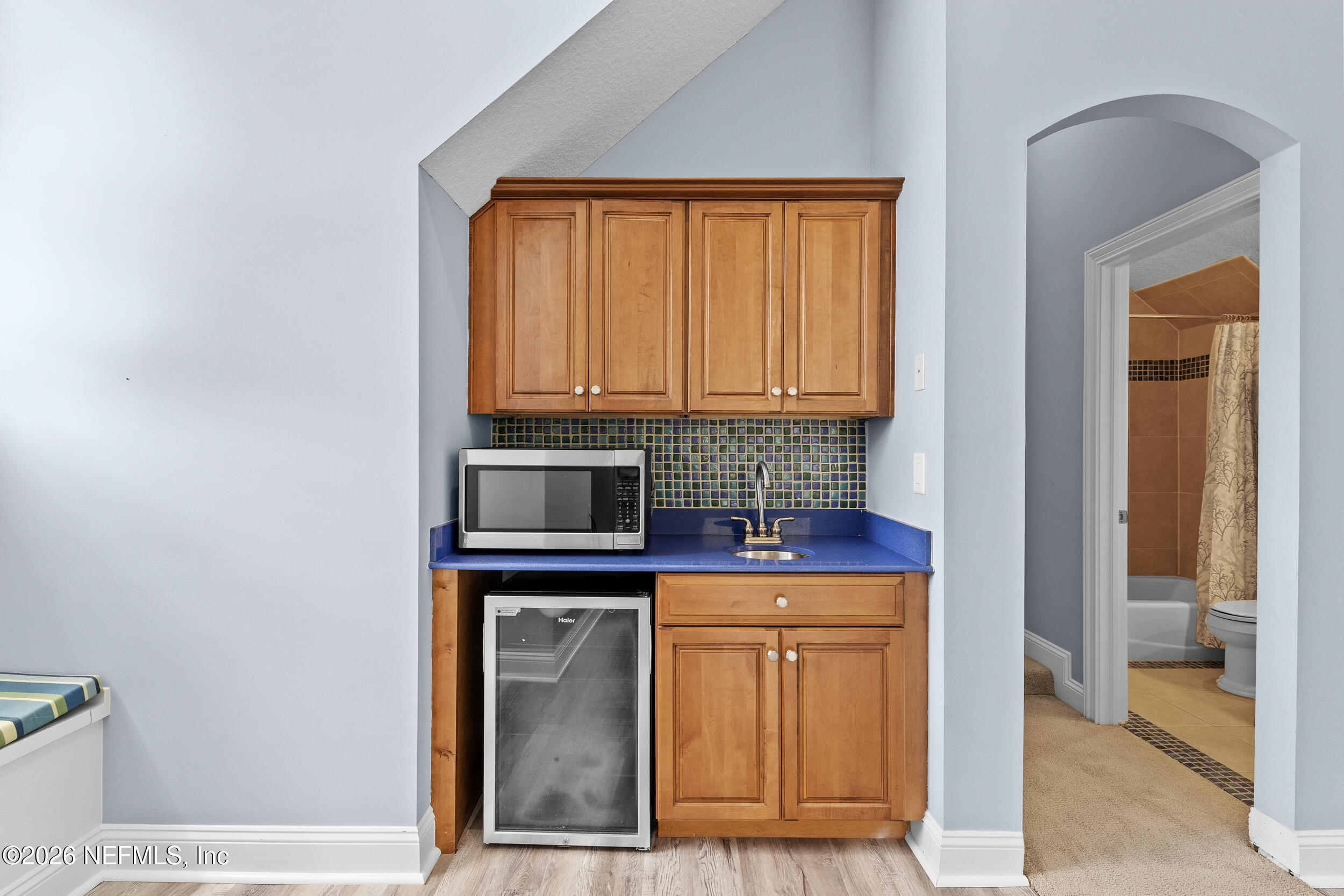 3225 Bishop Estates Road St. Johns, FL 32259 - Photo 57 of 90 a kitchen with stainless steel appliances granite countertop a stove and a microwave oven