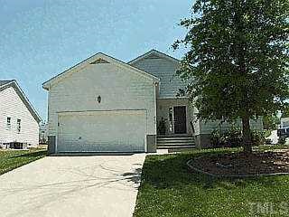 a view of outdoor space and front view of a house