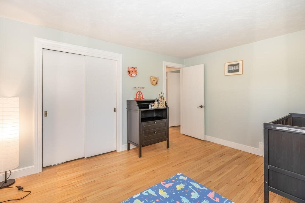382 Worcester Street Wellesley, MA 02481 - Photo 14 of 22 a view of a livingroom with wooden floor and closet
