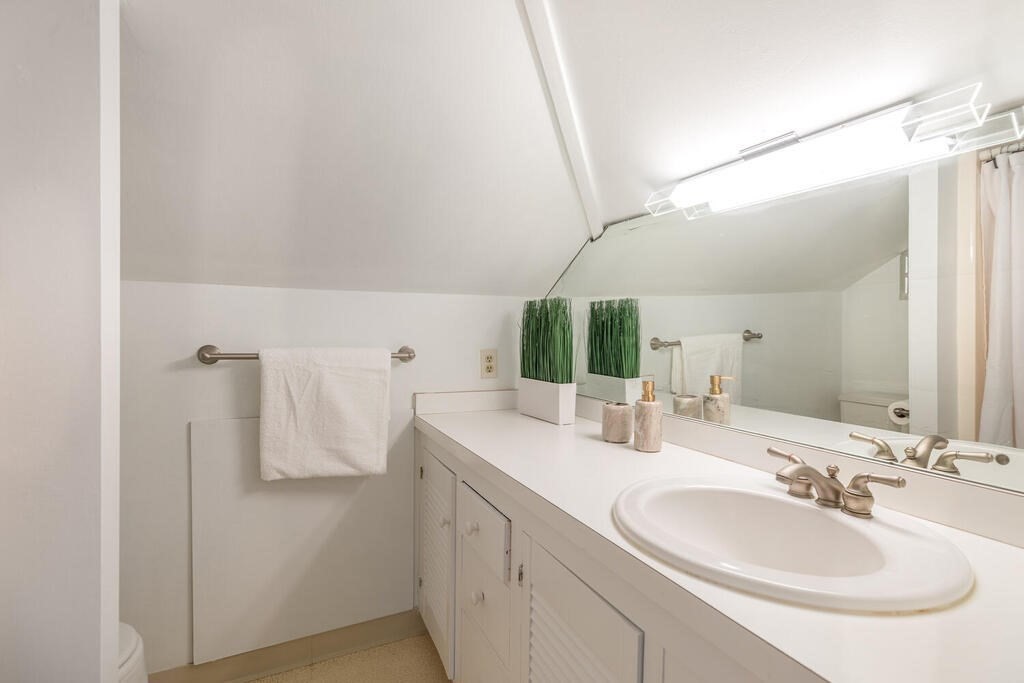 382 Worcester Street Wellesley, MA 02481 - Photo 17 of 22 a bathroom with a double vanity sink and mirror